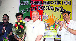 Chaman Lal Gupta being welcomed by JKDF leaders at the partys state executive - working committee meeting in Jammu on Saturday
