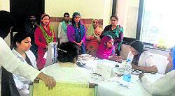 Doctors examine patients at a two-day cancer camp held in Rajouri