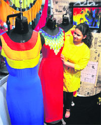 A student showcases her creations during the Glam-n-Glitter exhibition of designer garments organised by the Sportking Institute of Fashion Technology in Ludhiana. 