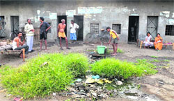 A boy pumps out water from a handpump at a vehra in Fauji Mohalla in Ludhiana. 