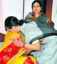 Congress chief Sonia Gandhi consoles Nand Kumar Patels family members in Raipur on Sunday