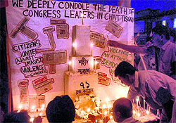 Congress activists light candles in memory of victims of Saturdays Maoists attack on a convoy of party leaders in Chhattisgarh