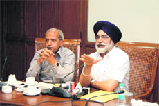 Sikander Singh Maluka (right), Education Minister, and Harcharan Bains, media adviser to CM, at a press meet in Chandigarh on Sunday.