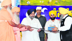 Deputy Chief Minister Sukhbir Badal being felicitated at a religious congregation in Goraya on Sunday.