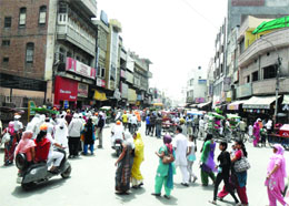 A narrow approach road to the Golden Temple in Amritsar.