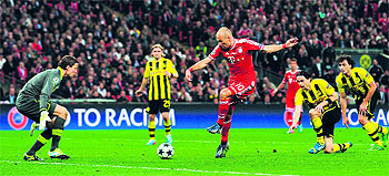 Bayern Munichs Dutch midfielder Arjen Robben scores the winning goal against Borussia Dortmund during the UEFA Champions League final at Wembley Stadium