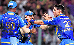 Mumbai Indians cricketers celebrate a wicket of Mumbai Indians batsman during IPL 6 Final Match at Eden Garden in Kolkata on Sunday