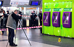 A police investigator at the site where a man armed with a knife attacked a French soldier on the outskirts of Paris, on Sunday