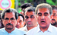 PTI leaders Shah Mahmood Qureshi (R) and Shafqat Mahmood brief the media in Lahore on Saturday