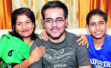Jatin Chopra, who scored 97 per cent marks in non-medical stream, flanked by his mother and brother in Bathinda on Monday
