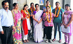Students celebrate their success in the CBSE Class XII results along with their teachers at RBDAV Senior Secondary School