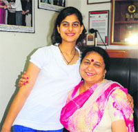 Preeti Yadav of GMSSS-16 (arts, 96.2%) with Principal of the school Anujeet Kaur.