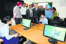 UT Administrator Shivraj V Patil inspects a computer lab at Government High School in Sector 54, Chandigarh, on Monday. 