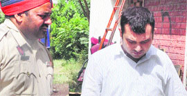 Bookie Ashwini Kumar in police custody in Mohali on Monday.