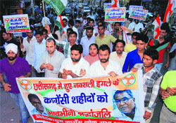 Youth Congress leaders take out a candlelight march in Ambala. 
