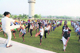Shiv Kumar Saini, lecturer of yoga at DAV College, Jagadhri, conducts a 10-day yoga camp for inmates of the District Jail inside the jail premises.