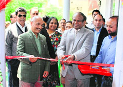 John Samuel, Chief Postmaster General, J&K, inaugurates a post office at University of Agricultural Sciences and Technology in Sringar on Monday. 