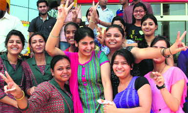 Girls celebrate after declaration of the CBSE Class XII results in Ludhiana on Monday. Tribune photo: Himanshu Mahajan