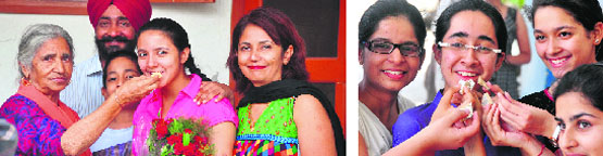 Amreen, topper in the medical stream with her family; and (right) Isha Ramneek, the joint topper.