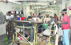 Workers at a hosiery unit in Ludhiana. A File photo