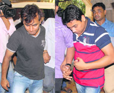 Two bookies, arrested from Pune in connection with IPL spot-fixing scandal, being produced at Killa court in Mumbai on Monday.