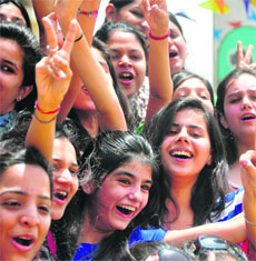 Students celebrate after the declaration of the CBSE Class XII examination in Ludhiana. 