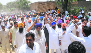 Congress workers gathered for PPCC chief Partap Singh Bajwas visit at Mann village in Muktsar on Monday. 