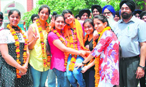 Students of Shri Guru Harkrishan Public School celeberate after the declaration of the CBSE Class XII examination in Amritsar.