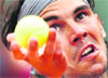 Rafael Nadal of Spain prepares to serve to Daniel Brands of Germany during their mens singles match at the French Open tennis tournament on Monday.  Reuters
