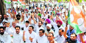 Against book scam: Congress activists protest against Punjab Education Minister Sikander Singh Maluka over alleged irregularities in purchase of books in government schools, in Amritsar on Tuesday