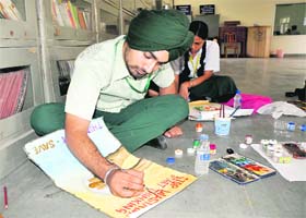 Creativity at work: Students participate in an on-the-spot painting contest at Police DAV Public School in Bathinda