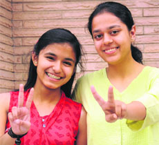 Saloni Bansal (left), who has secured 100 per cent marks in accountancy and maths, and Niharika, who scored 100 in maths and business studies in the CBSE Class XII examinations. 