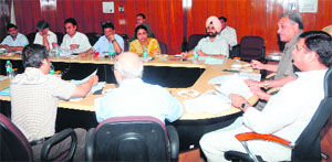 Chief Minister Vijay Bahuguna presides over a meeting to review the working of the Rural Development Department in Dehradun on Tuesday. 