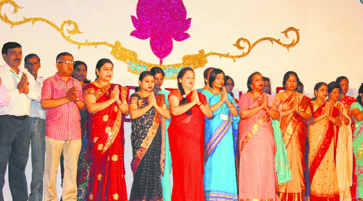 The staff of Oak Grove School sings a song during the 125th year anniversary celebrations in Mussoorie on Tuesday.