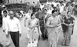 A woman contestant campaigns with her supporters in Hisar on Tuesday