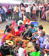 Passengers sit on the floor during the visit of GM, Northern Railway, VK Gupta, at the station in Jammu on Tuesday. tribune photo: Anand Sharma