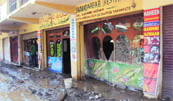 A view of the shops in the commercial building that were damaged by the landslide in Ramban on Monday. photo by writer