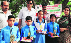 Participants of a seminar on biodiversity conservation at the Government Middle School, Seela, on Tuesday. A tribune photo 