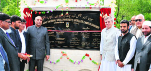 Union Minister of Human Resource Development MM Pallam Raju and Jammu and Kashmir Chief Minister Omar Abdullah after laying the foundation stone of the satellite campus of Moulana Azad National Urdu University at Budgam on Tuesday. Tribune Photo: Amin War