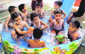 Children enjoy a pool party at Childhood Kindergarten School, Punjab Mata Nagar, Ludhiana