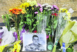 Tributes being paid to murdered soldier of the Royal Regiment of Fusiliers Le Rigby at the scene of incident near Woolwich Barracks in London on Tuesday. 