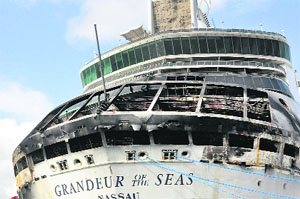 Damaged Royal Caribbean ship Grandeur of the Seas is docked in Freeport after a fire broke out on the ships aft mooring deck on Monday morning. All 2,224 passengers and 796 crew members are safe. 