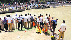 Passers-by at the Sirhind Canal where a Kotkapura resident drowned while taking bath.