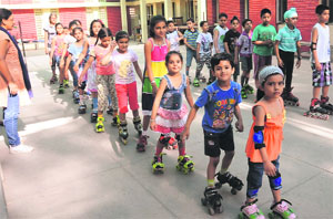Children take part in skating during a summer camp organised at St. Josephs Convent School in Bathinda on Wednesday.