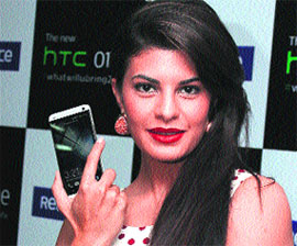 Bollywood actress Jacqueline Fernandez poses with HTC One smartphone at its launch in New Delhi on Wednesday. It is priced at Rs 42,990. 