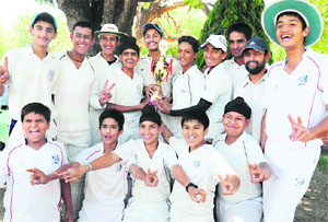Members of the YPS cricket team in a jubilant mood after winning the 2nd Brother McCann Cricket Tournament at the St Johns School in Chandigarh, on Wednesday.