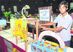 Anil Kumar showcases his project at a state-level exhibition held at GGDSD College in Sector 32, Chandigarh, on Wednesday.