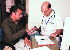A patient undergoes treatment during the J&K Bank medical camp in Reasi on Wednesday
