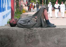 Rest time: A man takes nap by a roadside in Srinagar on Wednesday