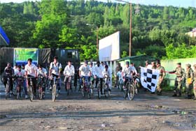 Youths participate in a cycle rally that was organised by 52 Rashtriya Rifles from Kanispora to Armargad Sopore in Baramulla district, on Wednesday